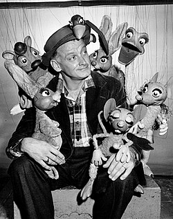 Art Carney poses with puppets made by Bil Baird for a 1958 TV version