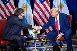 Milei shaking hands with Donald Trump in February 2025