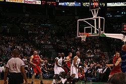 Anthony Parker (No. 18) and Jorge Garbajosa (No. 15) with the Raptors during the 2006–07 season. Parker and Garbajosa were signed by the Raptors in the 2006 off-season.