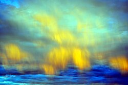 Down draft winds with associated virga allow these clouds in the eastern sky at civil twilight to mimic aurora borealis in the Mojave Desert.