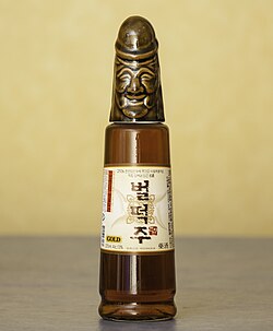 Bottle whose cap is a smiling penis