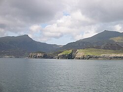Nicolson's Leap on the east coast of South Uist. In the background are Beinn Mhòr at left, and Hecla on the right.