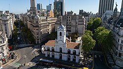 Bolívar Street facing the Cabildo and Diagonal Norte, in Buenos Aires' historical center. The city's characteristic convergence of diverse architectural styles can be seen, including Spanish Colonial, Beaux-Arts and modernist architecture.