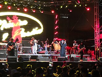 Maldita Vecindad band. Roco, the vocalist, dresses in a manner reminiscent of the pachucos.