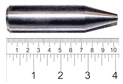 Shiny metallic cylinder with a sharpened tip. The overall length is 9 cm and diameter about 2 cm.