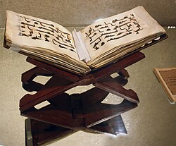 A Quran manuscript resting on a rehal, a book rest for the holy text, c. 9th century