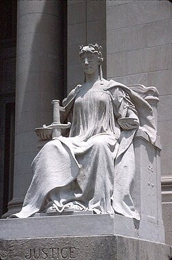Lady Justice (Latin: Justicia), symbol of the judiciary.[33][34] Statue at Shelby County Courthouse, Memphis, Tennessee
