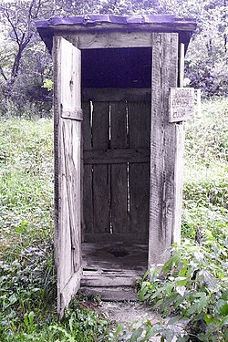 Outhouse with squat toilet inside (Poland)