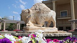 Old Main building on the campus of West Texas A&M University after construction of the Original Texans marble buffalo fountain