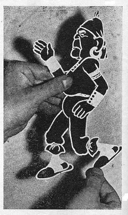 Cristiani showing in 1956 the cut and articulated figure of his satirical character El Peludo (based on President Yrigoyen); Cristiani patented these figures in 1916 for the realization of his films.