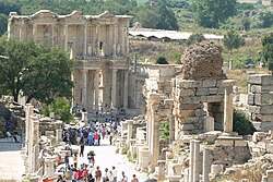 View west along the Harbour Street towards the Library of Celsus in Ephesus, present-day Turkey. The pillars on the left side of the street were part of the colonnaded walkway apparent in cities of late antique Asia Minor.