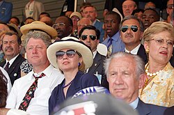 President Bill Clinton (left, white shirt) and First Lady Hillary Clinton (in blue, wearing sunglasses) watching the opening match in Chicago along the then International Olympic Committee president Juan Antonio Samaranch