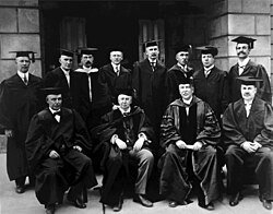 Photograph of Michigan University Regents 75th Anniversary Celebration on June 27, 1912. Standing L-R: Frank B. Leland, John H. Grant, Shirley W. Smith, Harry O. Bulkey, William L. Clements, Lucius Lee Hubbard, Benjamin Hanchett, Junius E. Beal Seated L-R: Luther L. Wright, James B. Angell, Harry B. Hutchins, Walter M. Sawyer
