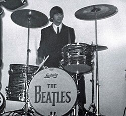 Starr performing with the Beatles in 1964