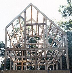 The completed frame of a modern timber-frame house