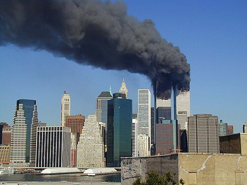 The Twin Towers of the World Trade Center burning during the September 11 attacks, planned by Osama bin Laden and carried out by al-Qaeda members in New York City on September 11, 2001