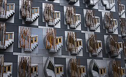 The distinctive windows of the MSP building inspired by Henry Raeburn's painting The Skating Minister