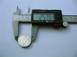 A caliper is used to precisely measure a short length.
