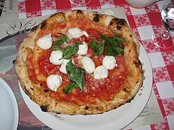 The ingredients of traditional pizza Margherita—tomatoes (red), mozzarella (white), and basil (green)—are held by popular legend to be inspired by the colors of the national flag of Italy.[57]