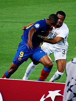 Evra (right) defending against Samuel Eto'o in the 2009 UEFA Champions League Final