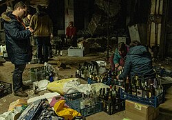 Civilians in Kyiv preparing Molotov cocktails, 26 February 2022
