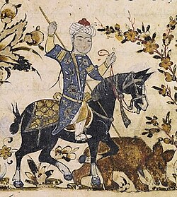 Horseman impales a bear. Nihāyat al-suʾl by Aḥmad al-Miṣrī ("the Egyptian"), dated 1371, Mamluk Egypt or Syria. He is wearing the kallawtah headgear.[56]