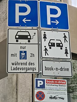 Traffic signs for car sharing and charging parking for e-cars in Germany.