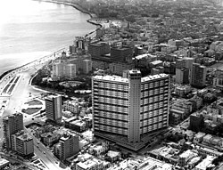 Aerial view of the FOCSA building from the west, with the floating corridors, ca. 1958