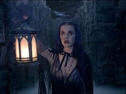 Perry as she explores a crepuscular labyrinth with a lantern in the music video for "Wide Awake"