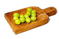 A Spanish tradition consists of eating Twelve Grapes at midnight on New Year's Day, one at each of the twelve strikes of the clock bell ringing at the Puerta del Sol in Madrid.