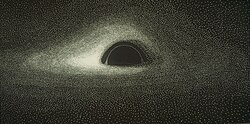 A black-and-white image of a black hole with an accretion disk on punch cards. The black hole is visible as a black semicircle in the center with a white ring overlaid. Around it, a bright white accretion disk wraps around the top and bottom of the black hole and to its sides, appearing brightest on the left side of the black hole.