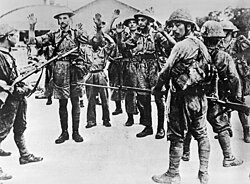 Troops of the Suffolk Regiment surrendering to the Japanese after the Battle of Singapore, 1942