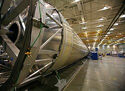 The SpaceX Falcon 9 booster in a hangar.