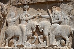 Ahura Mazda (on the right, with high crown) presents Ardashir I (left) with the ring of kingship. (Naqsh-e Rostam, 3rd century AD)