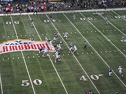Action during the 2011 Alamo Bowl, with the logo of the corporate sponsor, Valero, at mid-field