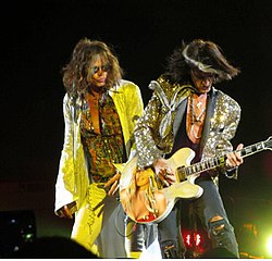 Steven Tyler and Joe Perry of Aerosmith performing in 2012. The duo became known as the "Toxic Twins" in the 1970s due to their heavy drug use. Both Tyler and Perry have battled serious drug addiction, with periods of relapse and sobriety.
