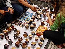 Selection of yerba mate gourds and bombillas at a street vendor in Buenos Aires, Argentina