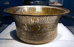 Basin made for Ayyubid Sultan As-Salih Ayyub, Damascus, Syria, 1247–1249. Brass inlaid with silver. Freer Gallery of Art.[111]