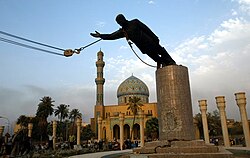 The toppling of Saddam Hussein's statue in Firdos Square in Baghdad shortly after the American invasion of Iraq in 2003