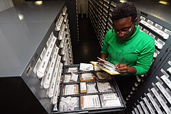 A logistics specialist inventories supplies in a storeroom aboard the aircraft carrier USS George H. W. Bush during Operation Enduring Freedom in the Persian Gulf in October 2011.
