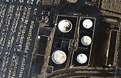 Hurricane Katrina: aerial photo of oil spill in Chalmette, showing oil slick on streets (September 2005).