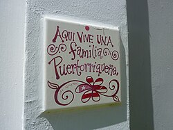 "A Puerto Rican family lives here" sign on a wall in San Juan