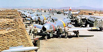 USAF North American F-86 Sabre fighters from the 51st Fighter Interceptor Wing Checkertails are readied for combat during the Korean War at Suwon Air Base.