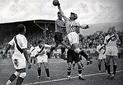 Peruvian goalkeeper Juan Valdivieso reaches out for the football during match between Austria and Peru