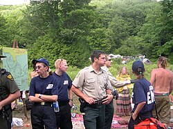 Police and medics near "trading circle" at the annual U.S. national Rainbow Gathering in West Virginia, 2005