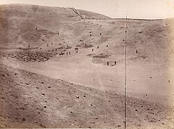 After the battle, Chilean soldiers standing on the Peruvian defense line, top on the hills. Dead bodies at the bottom of the valley.