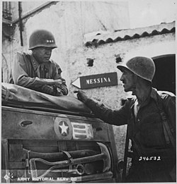 Lieutenant Colonel Lyle W. Bernard, commanding the 2nd Battalion, 30th Infantry Regiment, in conversation with Patton, near Brolo, Sicily, July 1943