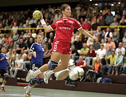 Women's handball – a jump shot completes a fast-break.