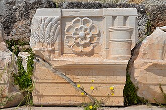 Roman relief with inscription and wheat decorations from the archeological site