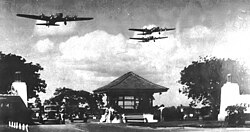 Boeing B-17D Fortresses of the 5th Bombardment Group overfly the main gate at Hickam Field, Hawaii Territory during the summer of 1941. 21 B-17C/Ds had flown to Hawaii in May to reinforce the islands' defense.